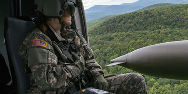 Female Vermont National Guard solider riding on chopper.